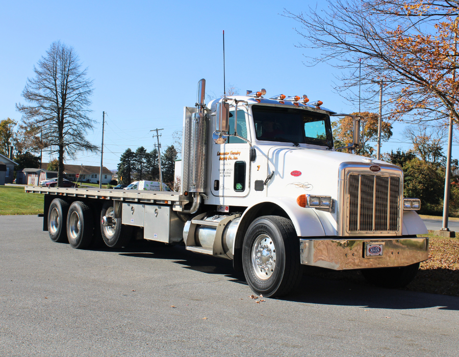 A Lancaster Foundry Supply Company flatbed truck parked outside